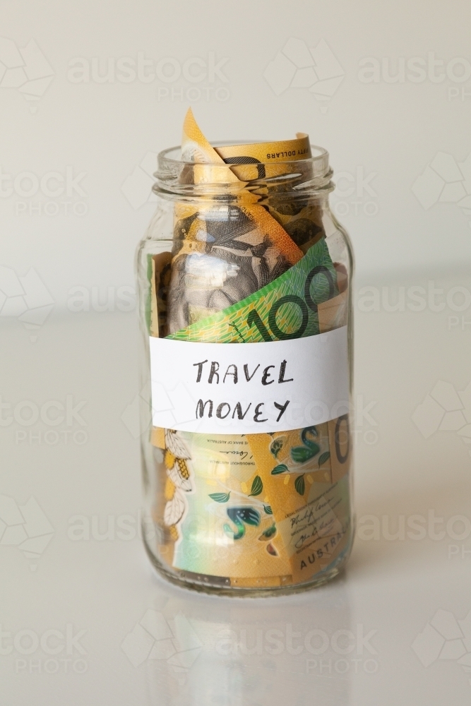 Travel money jar full of australian notes for holiday trip - Australian Stock Image