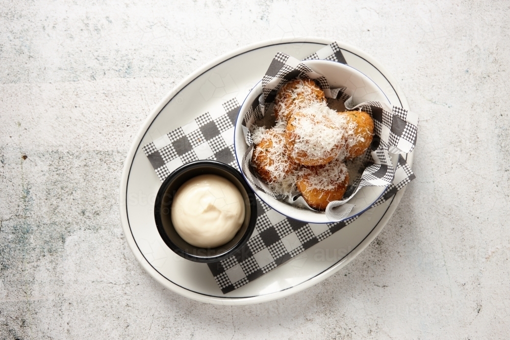 Truffle arancini balls on plate with mayonnaise - Australian Stock Image