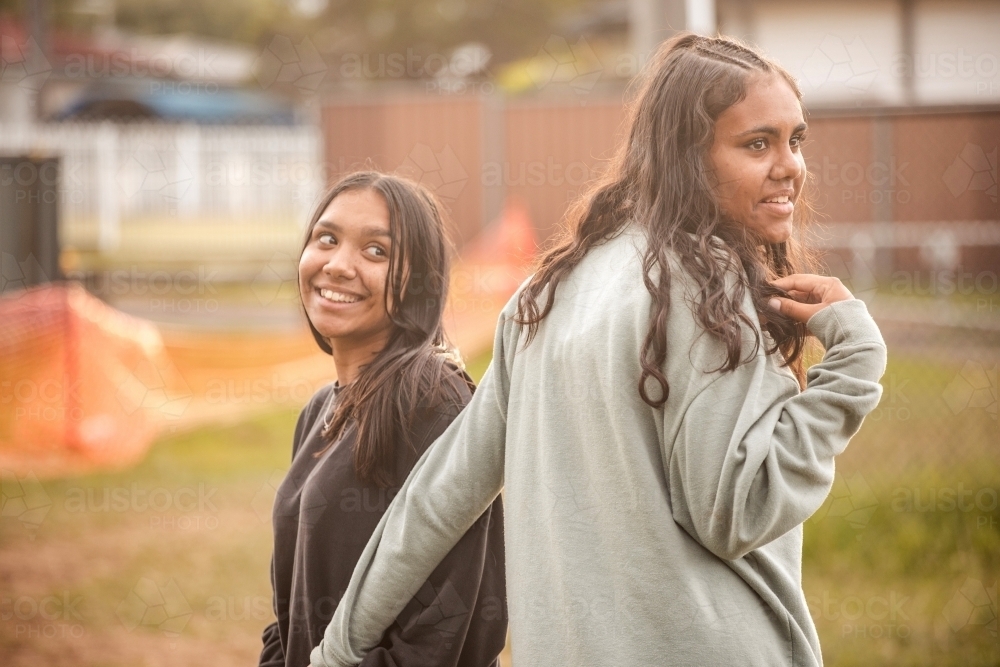 Two Aboriginal girls together outside - Australian Stock Image