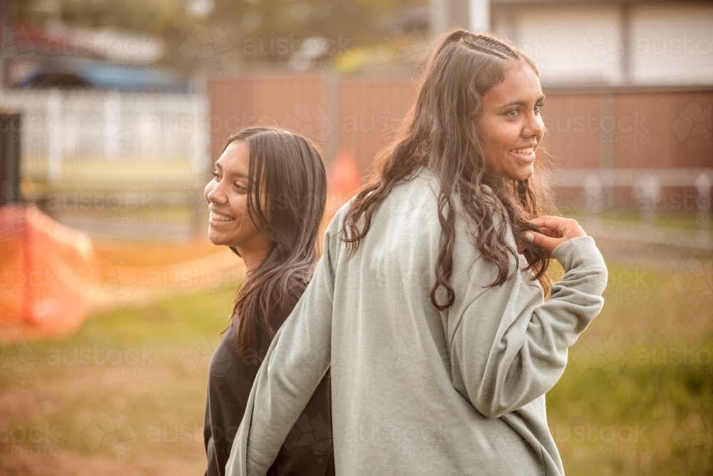 Two Aboriginal girls together outside - Australian Stock Image