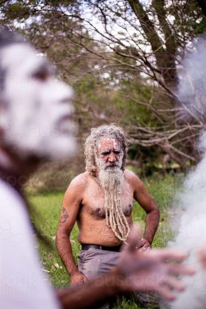 Two Aboriginal men at a smoke ceremony - Australian Stock Image