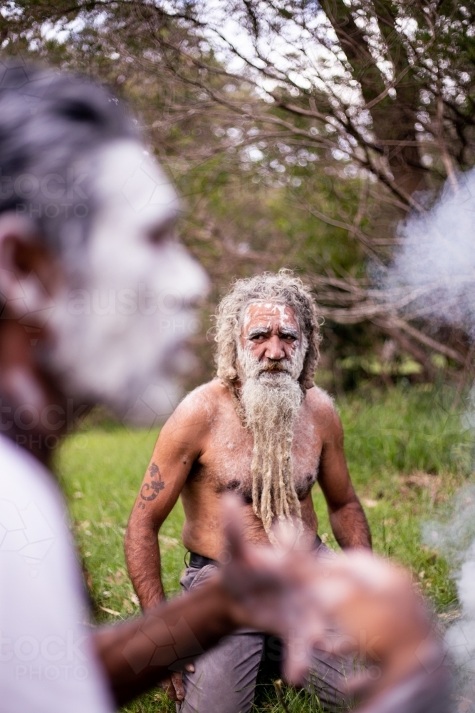 Two Aboriginal men at a smoking ceremony - Australian Stock Image