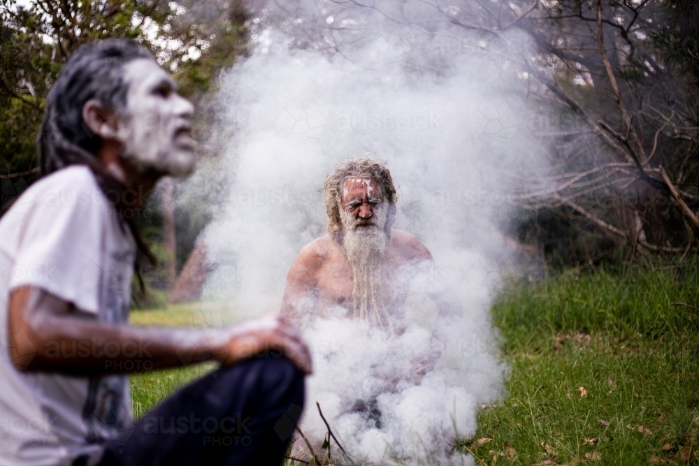 Two Aboriginal men at a smoking ceremony - Australian Stock Image