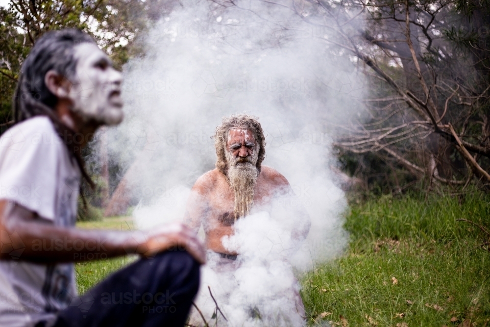 Two Aboriginal men at a smoking ceremony - Australian Stock Image