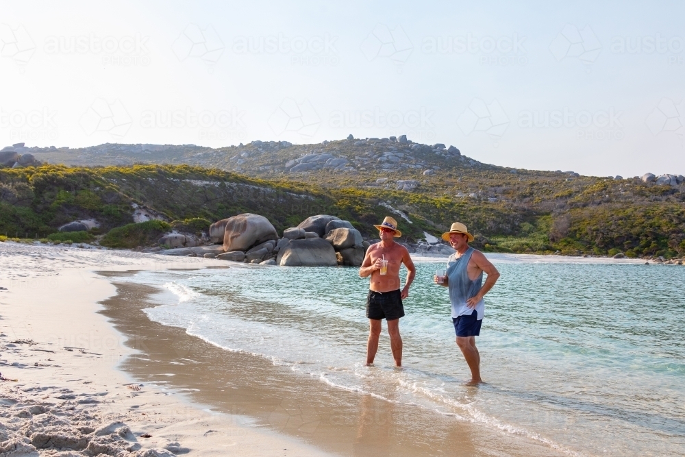 two blokes cooling off at the beach - Australian Stock Image