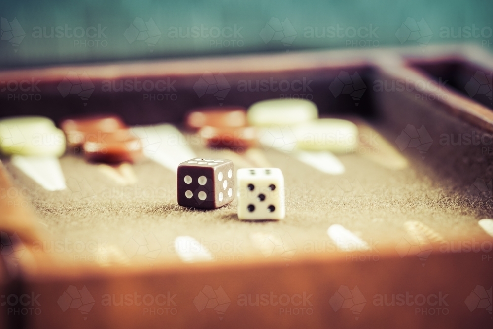 two dice on a backgammon board - Australian Stock Image