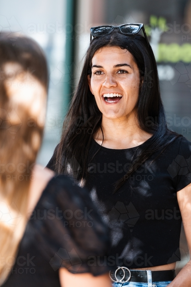 two friends chatting - Australian Stock Image