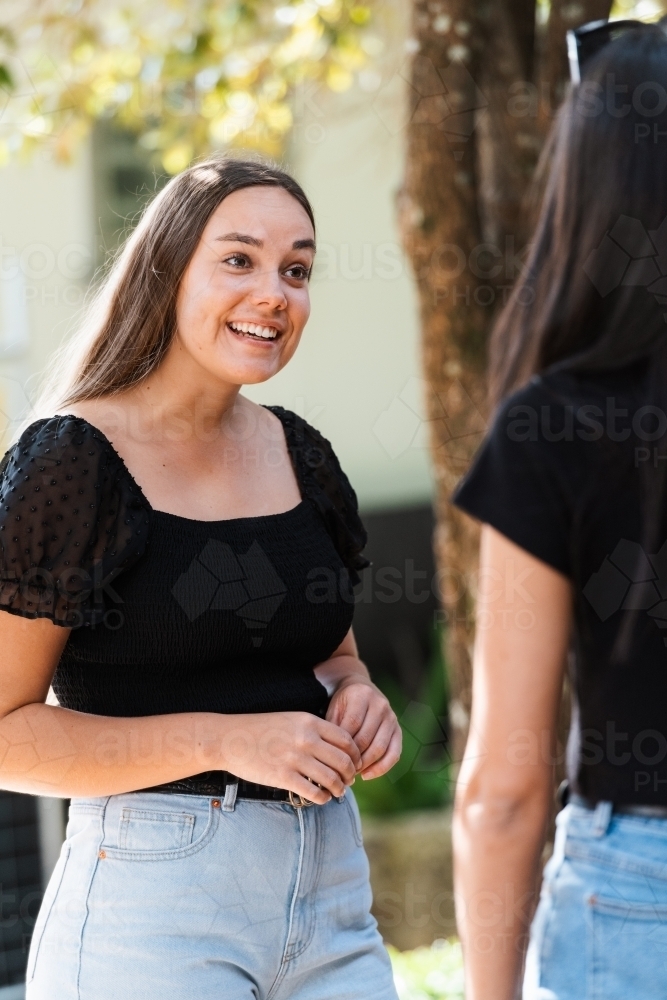 two friends chatting - Australian Stock Image