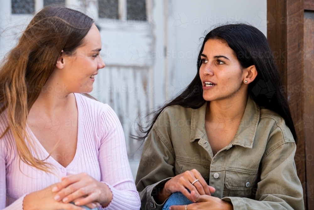 two friends chatting - Australian Stock Image