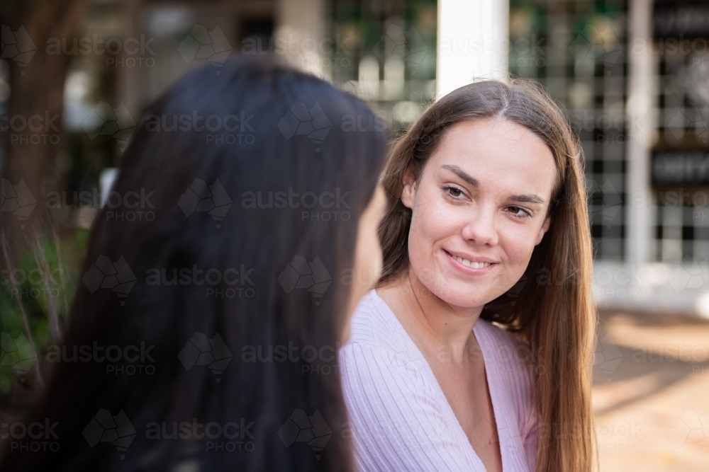 two friends chatting - Australian Stock Image