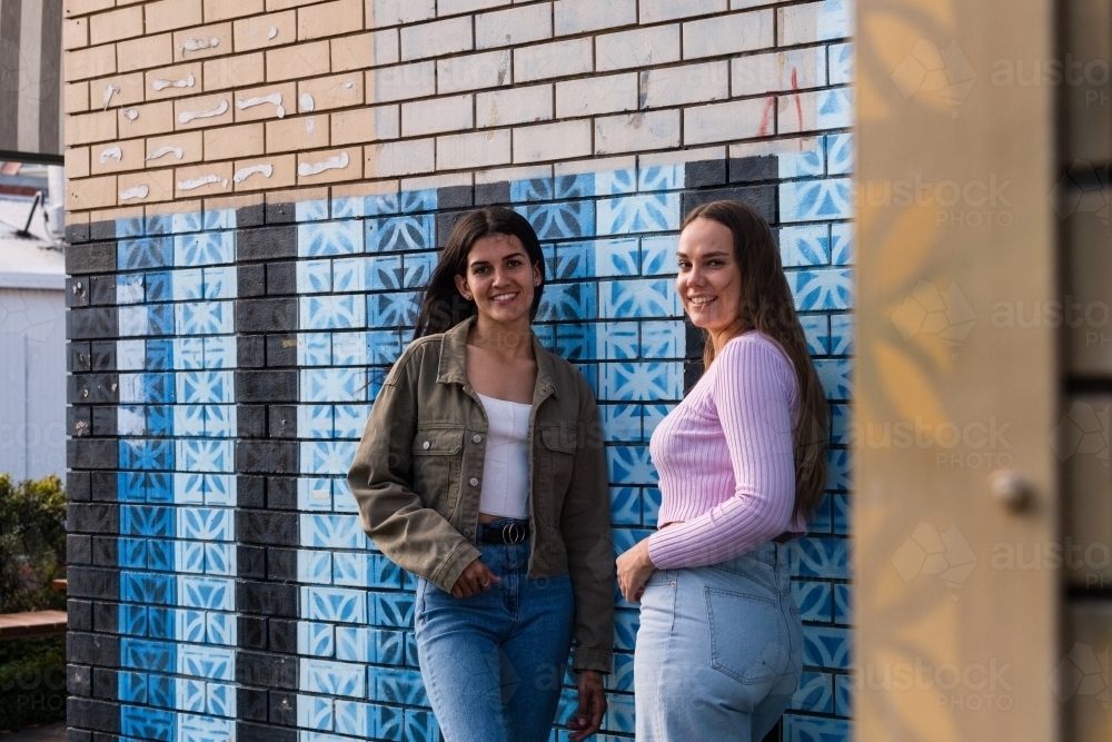 two friends hanging out in an urban setting - Australian Stock Image