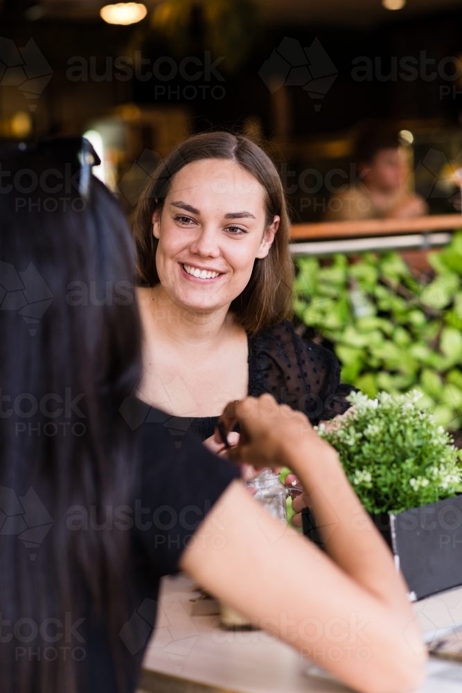 two friends in a cafe - Australian Stock Image