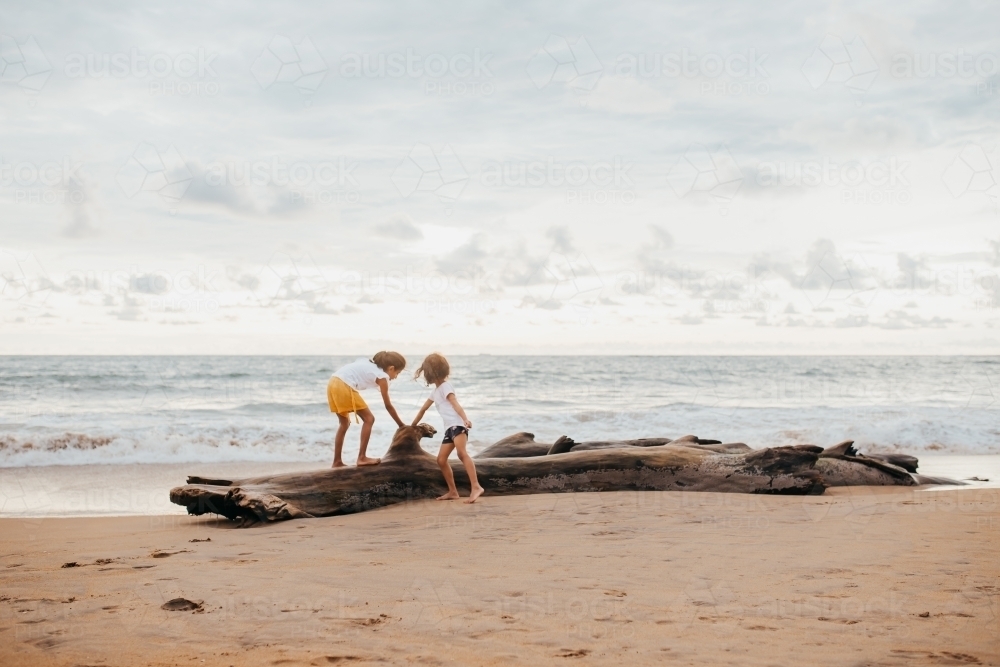 two girls playing at the beach - Australian Stock Image