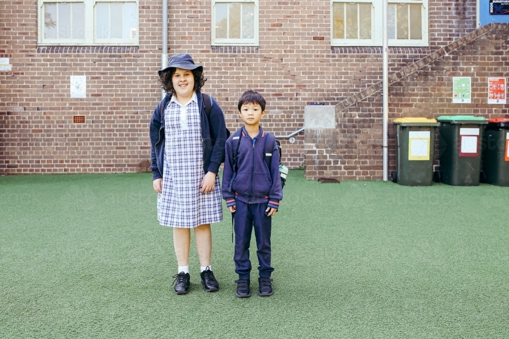 The Primary School Students Standing in Yard. Stock Image - Image