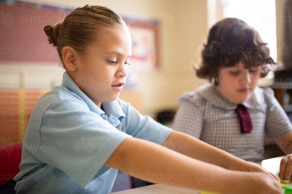 Two primary school girl students in a classroom - Australian Stock Image