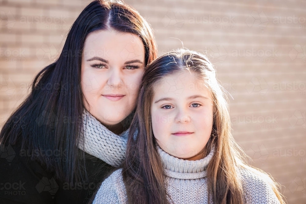 Two sisters looking serious - Australian Stock Image