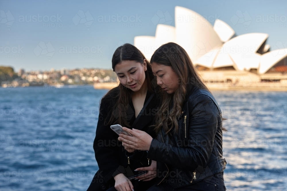 Two sisters spending time together harbourside - Australian Stock Image