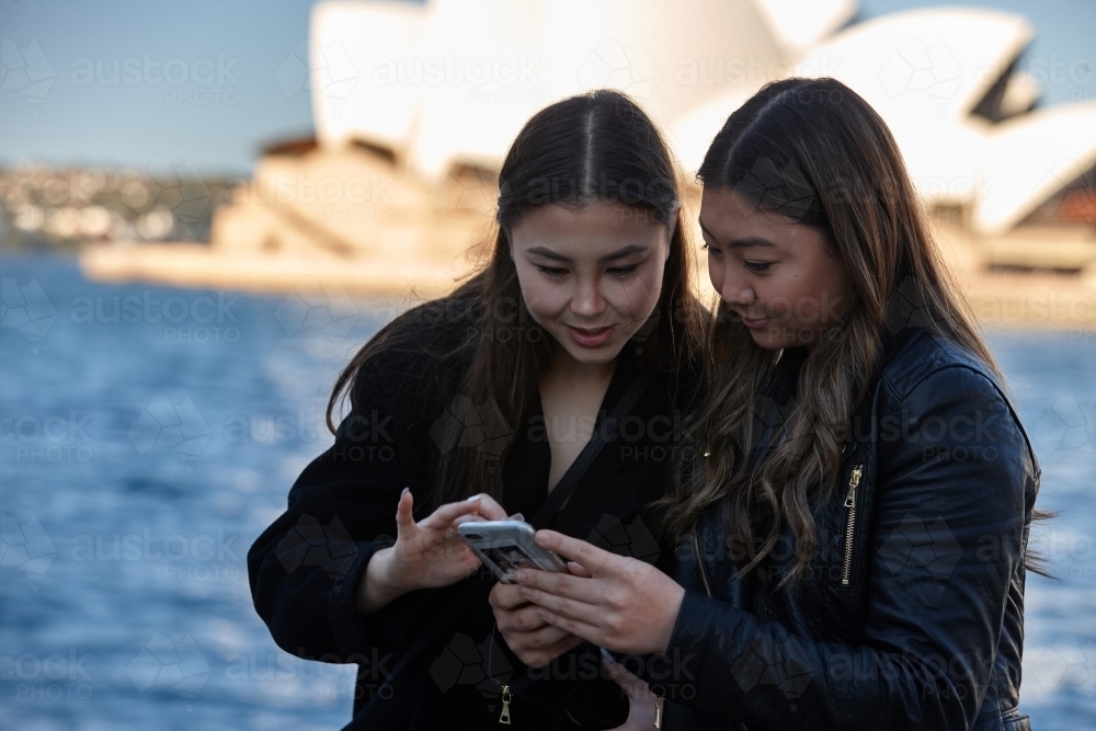 Two sisters spending time together harbourside - Australian Stock Image