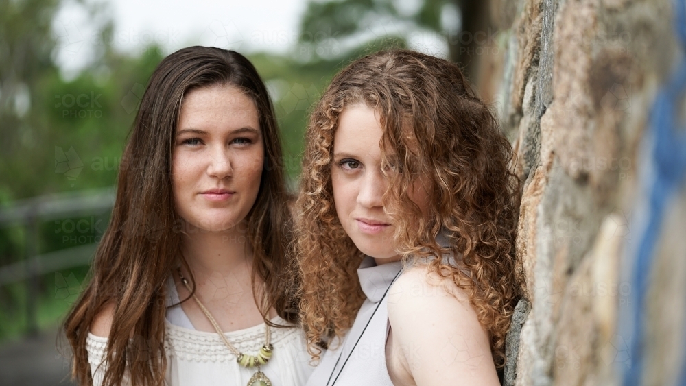 Two teen girls looking at camera - Australian Stock Image