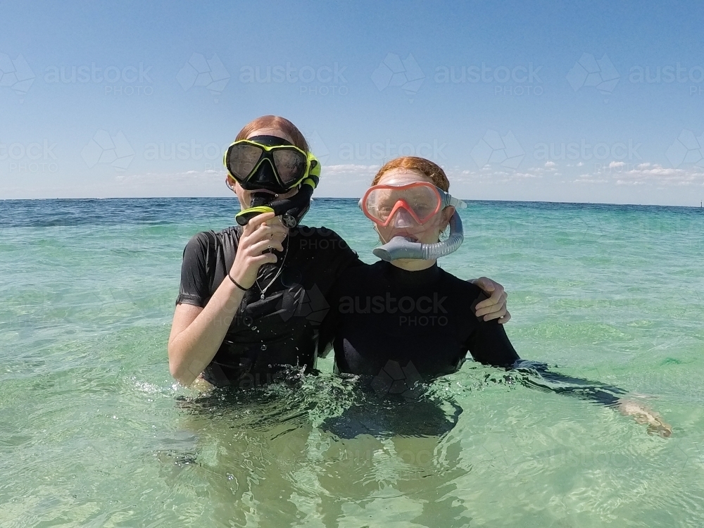 Two teenage girls snorkelling in the ocean - Australian Stock Image