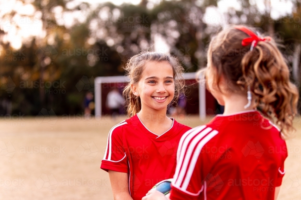 Two tween football players at practise - Australian Stock Image