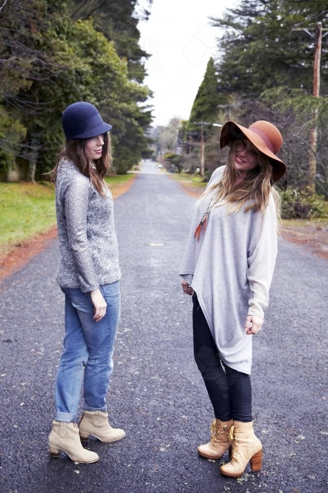 Two women on empty road - Australian Stock Image