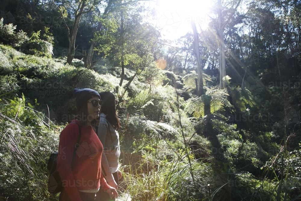 Two women standing in the bush - Australian Stock Image