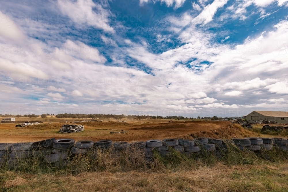 Tyre safety barrier around motocross track - Australian Stock Image