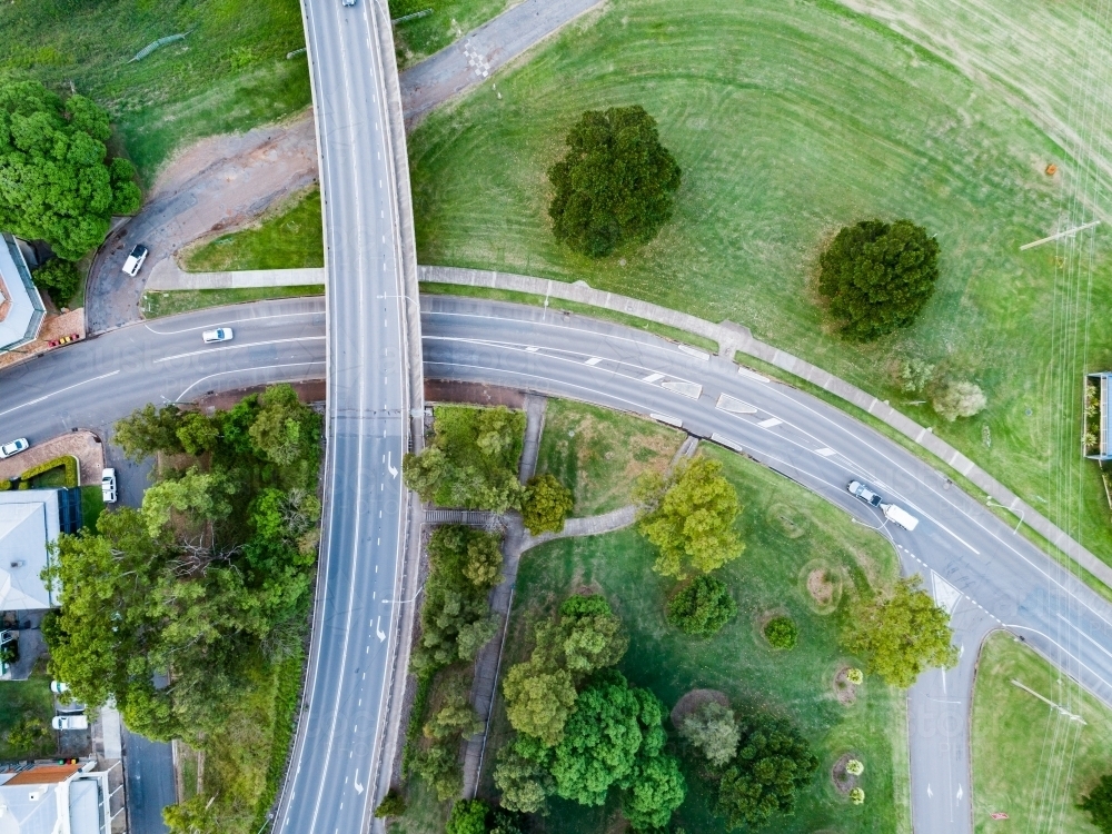 Underpass and bridge with green parkland alongside - Australian Stock Image