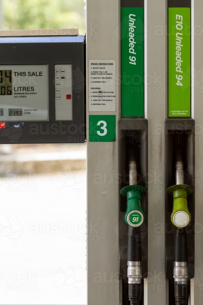 Unleaded 91 and E10 fuel nozzles at petrol pump bowser. - Australian Stock Image