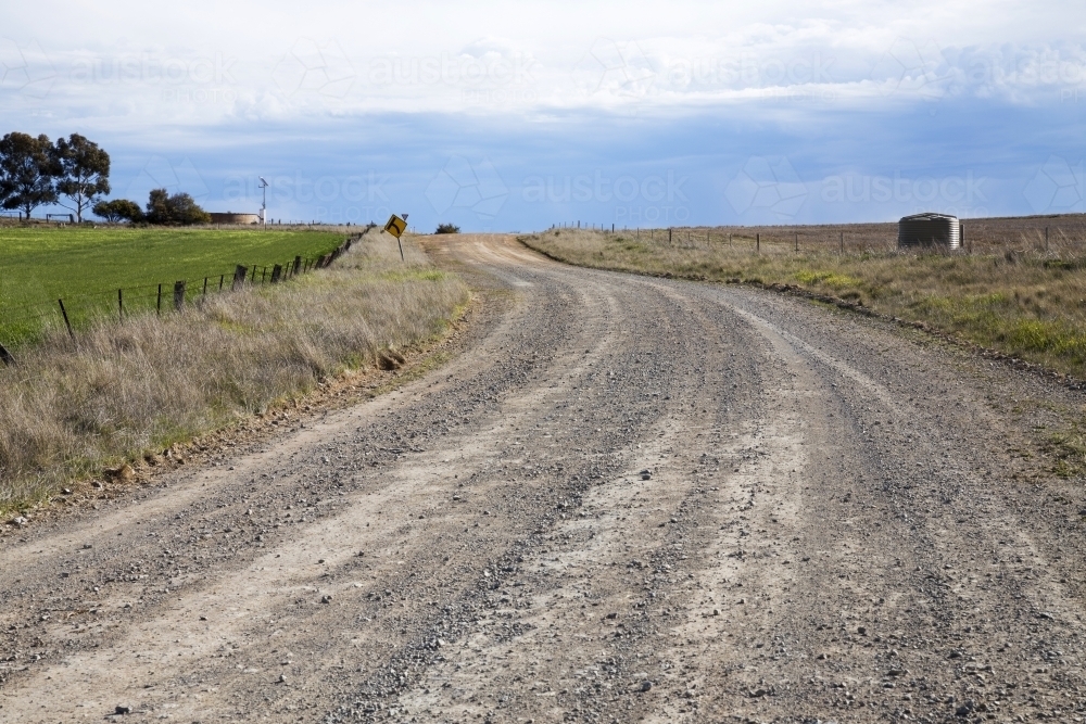 Image Of Unsealed Dirt Road Winding Up A Hill Austockphoto