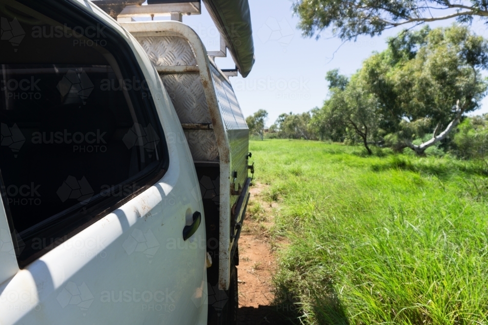 Up close side angle of 4wd ute setup with lush green bush in the background - Australian Stock Image