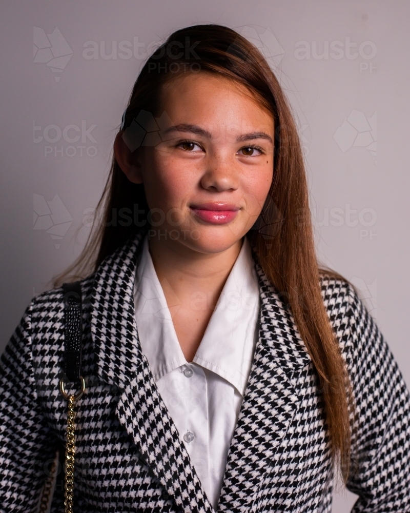 upper class teen girl in a jacket - Australian Stock Image