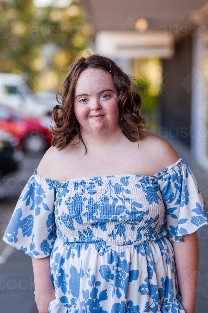 Urban portrait of aussie teen with down syndrome outside shopping centre - Australian Stock Image