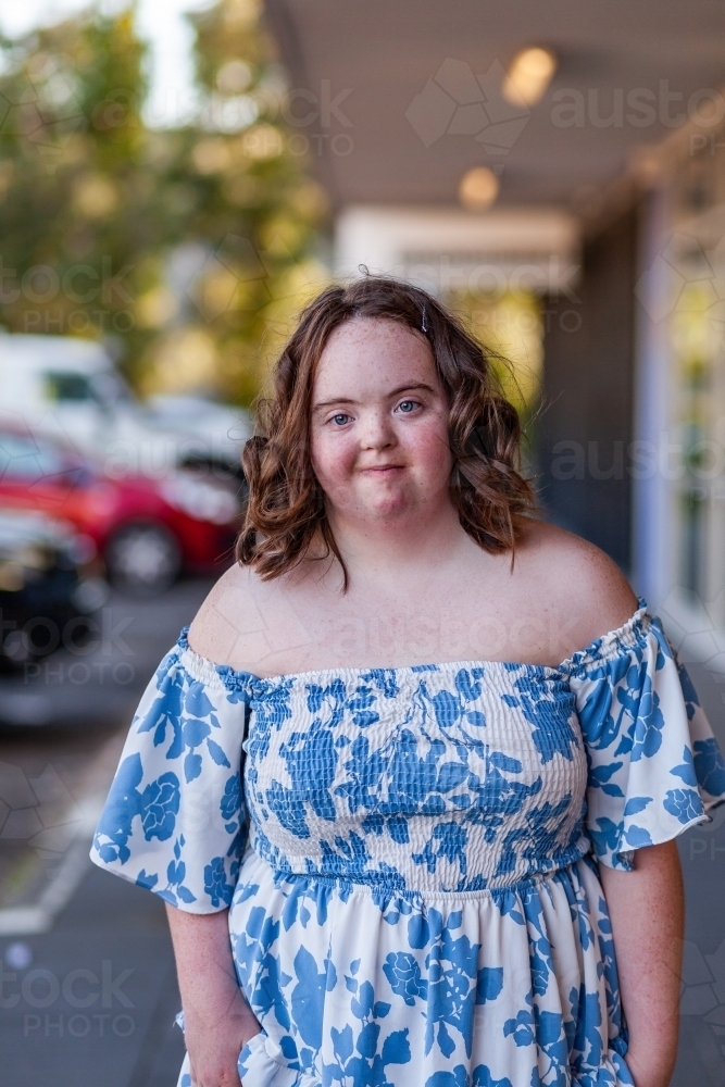 Urban portrait of aussie teen with down syndrome outside shopping centre - Australian Stock Image