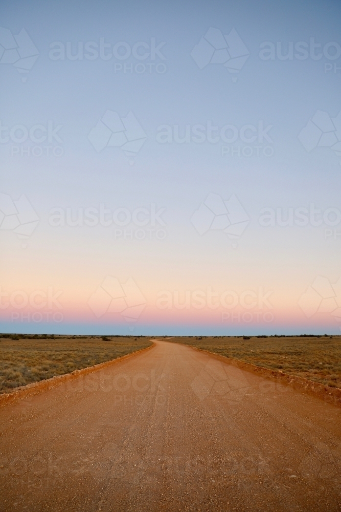 Vertical shot of a dusty road at sunset - Australian Stock Image