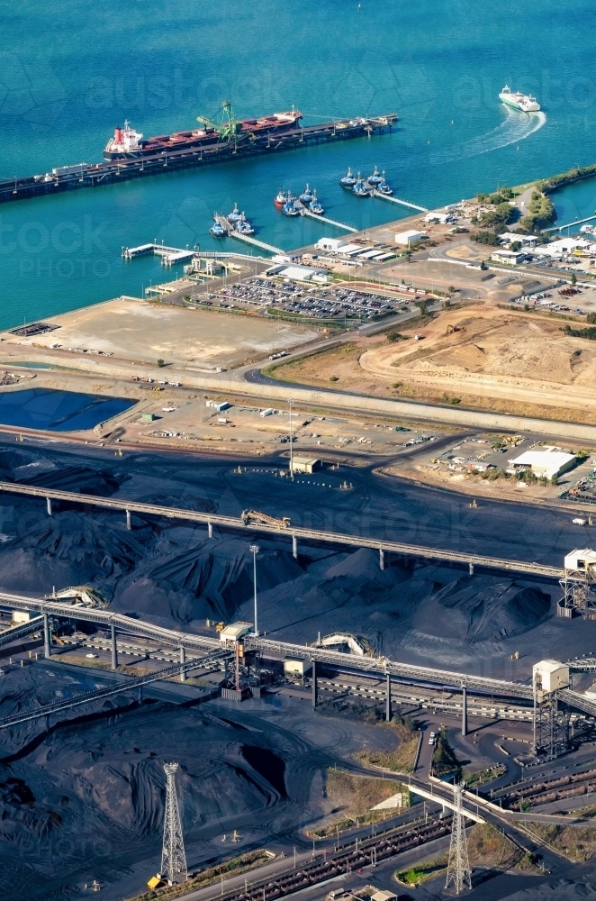 Vertical shot of pilot boats and RG Tanna coal wharfs and piles - Australian Stock Image