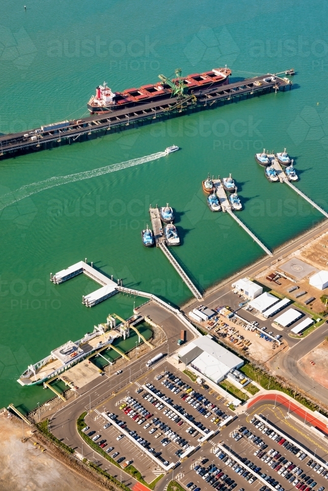 Vertical shot of pilot boats and RG Tanna coal wharfs and piles - Australian Stock Image