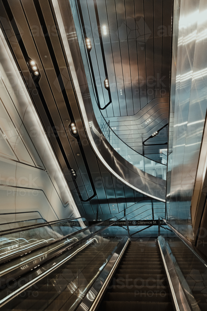 View from an escalator in a futuristic looking interior - Australian Stock Image