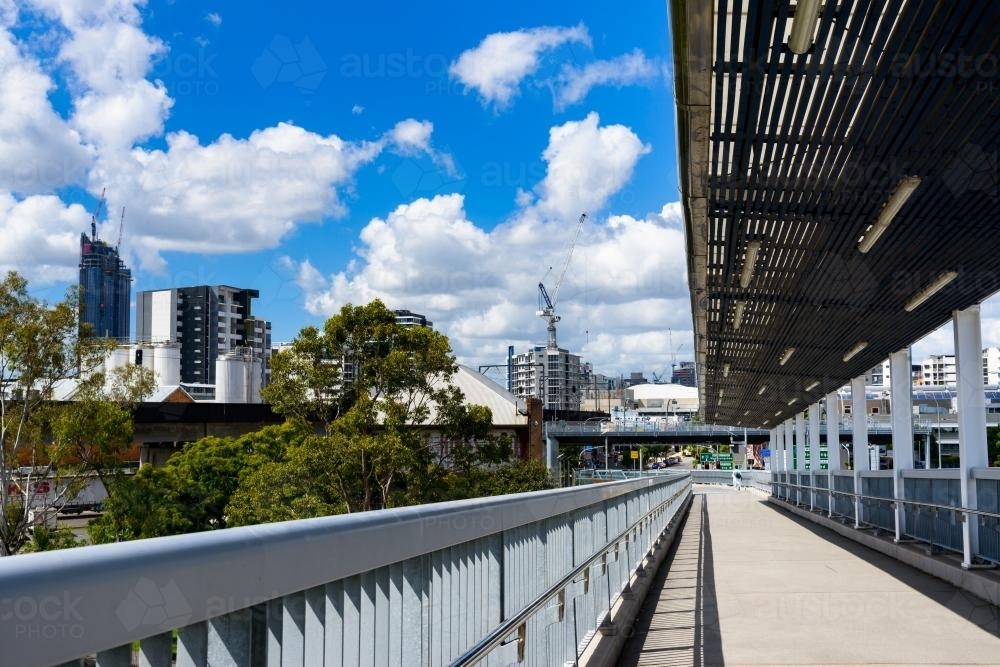 View from the pedestrian and bikeway on the Go Between Bridge with pedestrian in distance - Australian Stock Image