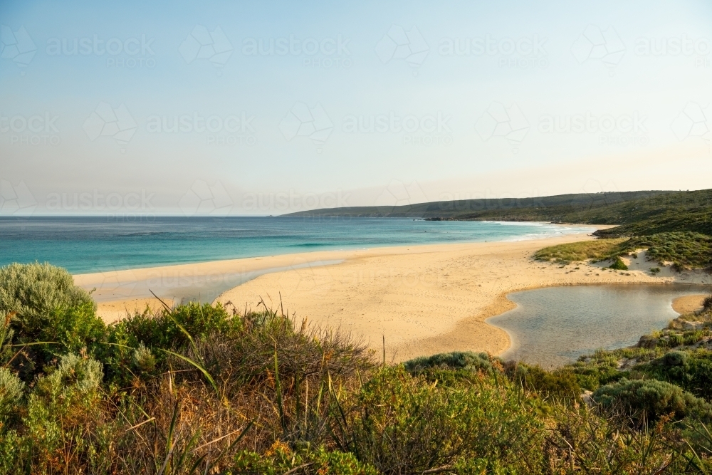 View of beach and ocean from top of sand dune - Australian Stock Image