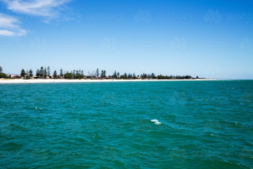 View of beach front houses across water - Australian Stock Image