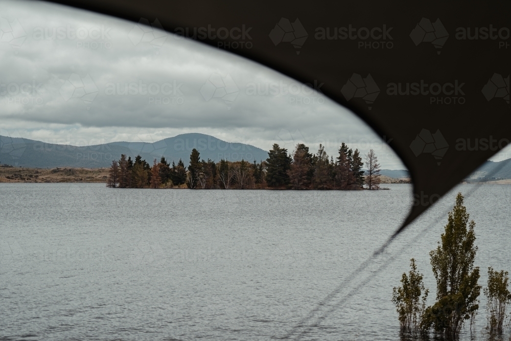 View of Lake Jindabyne while camping on overcast day - Australian Stock Image