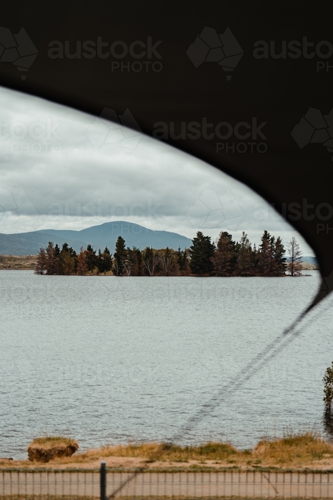 View of Lake Jindabyne while camping on overcast day - Australian Stock Image