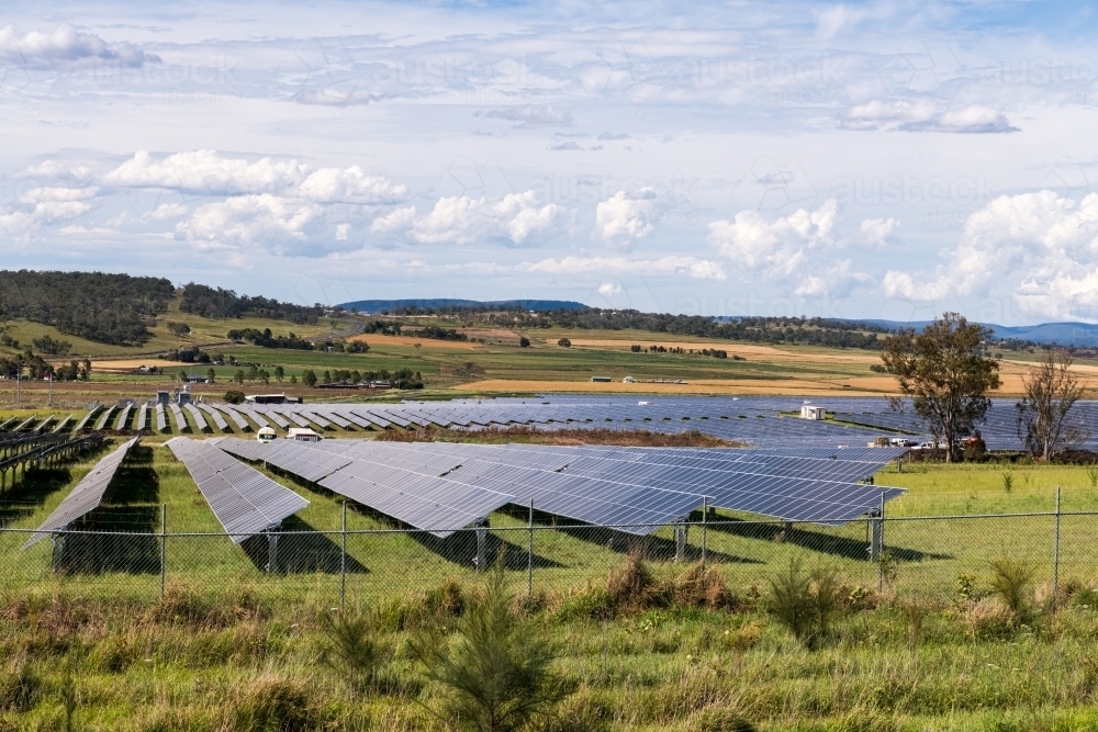 View of large scale solar farm in rural setting - Australian Stock Image