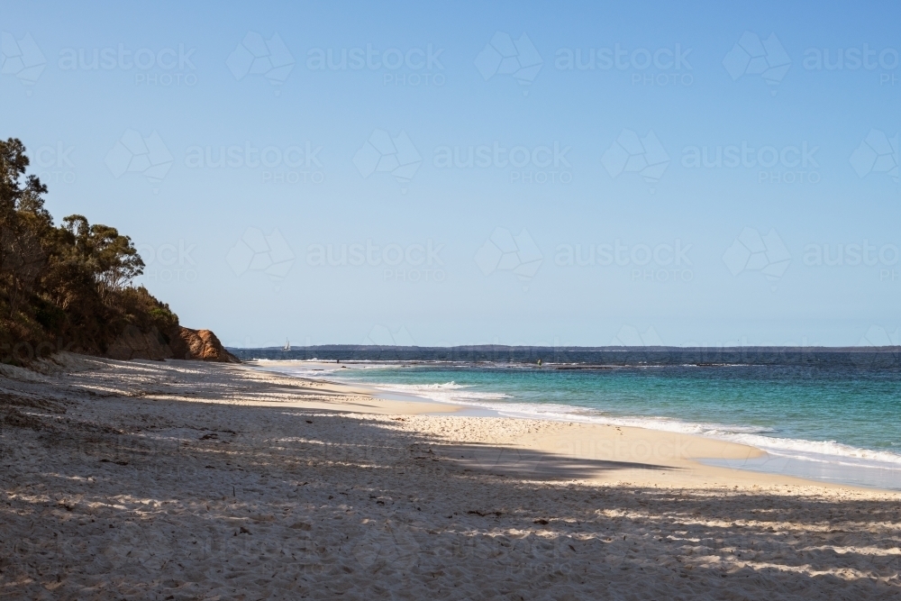 View of white sandy beach and blue water - Australian Stock Image