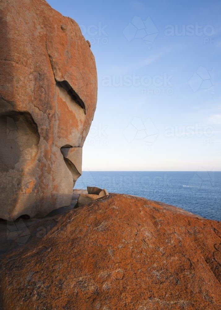 View over flat sea from the orange Remarkable Rocks on Kangaroo Island - Australian Stock Image