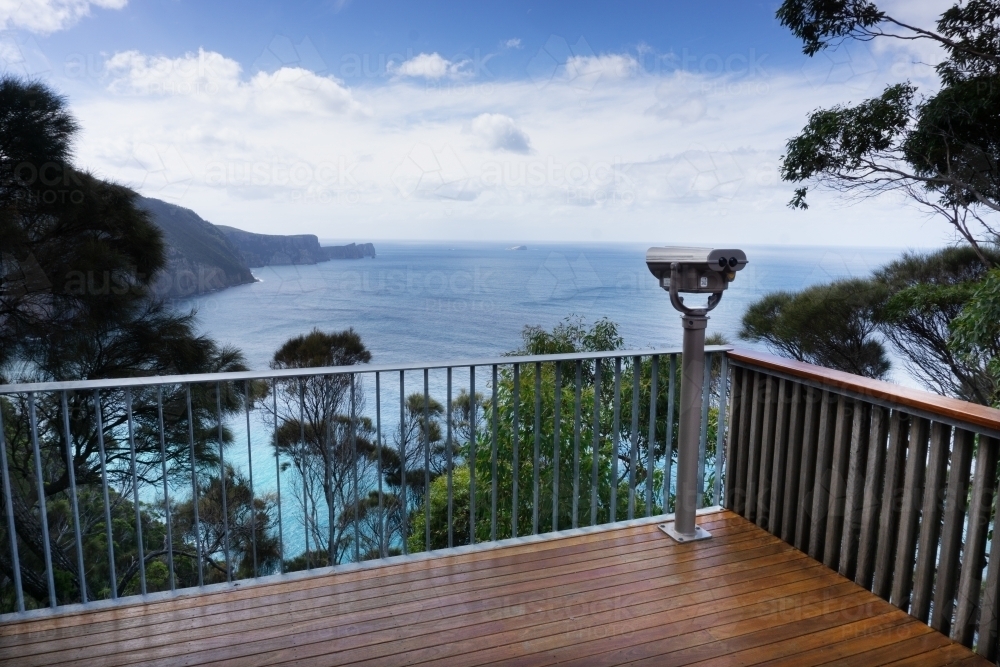 Viewing platform with railing over Tasman Peninsula coastline - Australian Stock Image