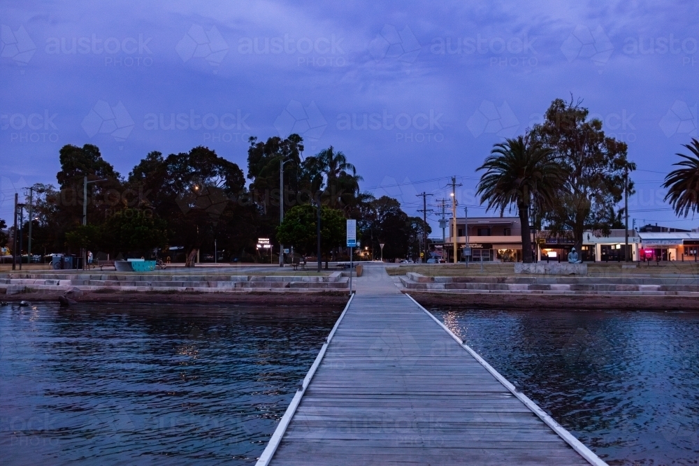 Warners Bay Public Jetty and esplanade in dusk light at nightfall - Australian Stock Image