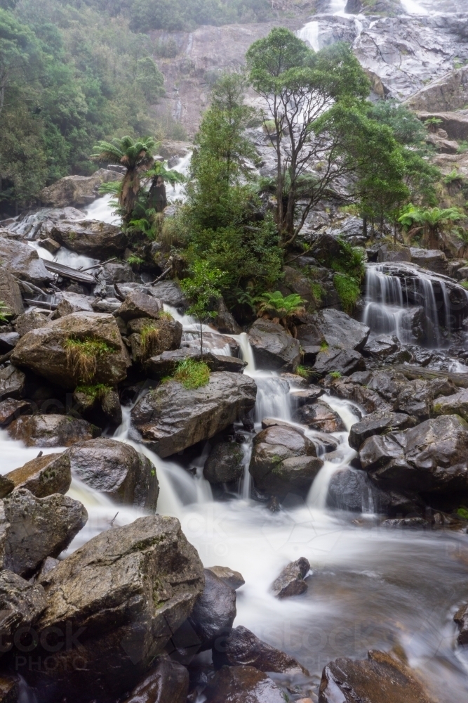 Water flowing over rocks at St Columba Falls - Australian Stock Image